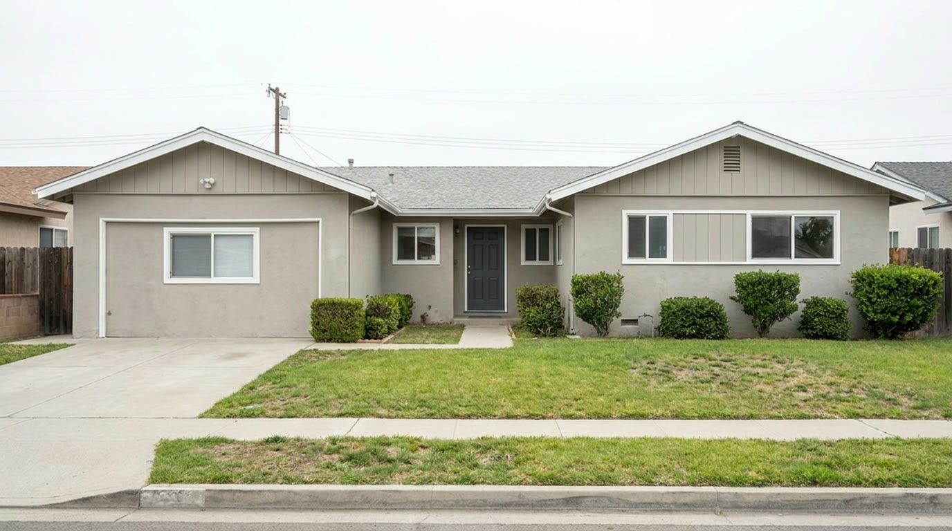 Single story ranch home freshly painted in warm greige with white trim
