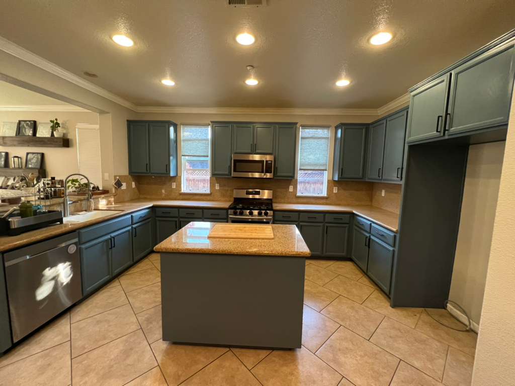 Dark wood kitchen cabinets before refinishing