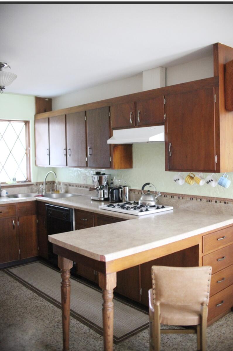Same home repainted gray with stone accents